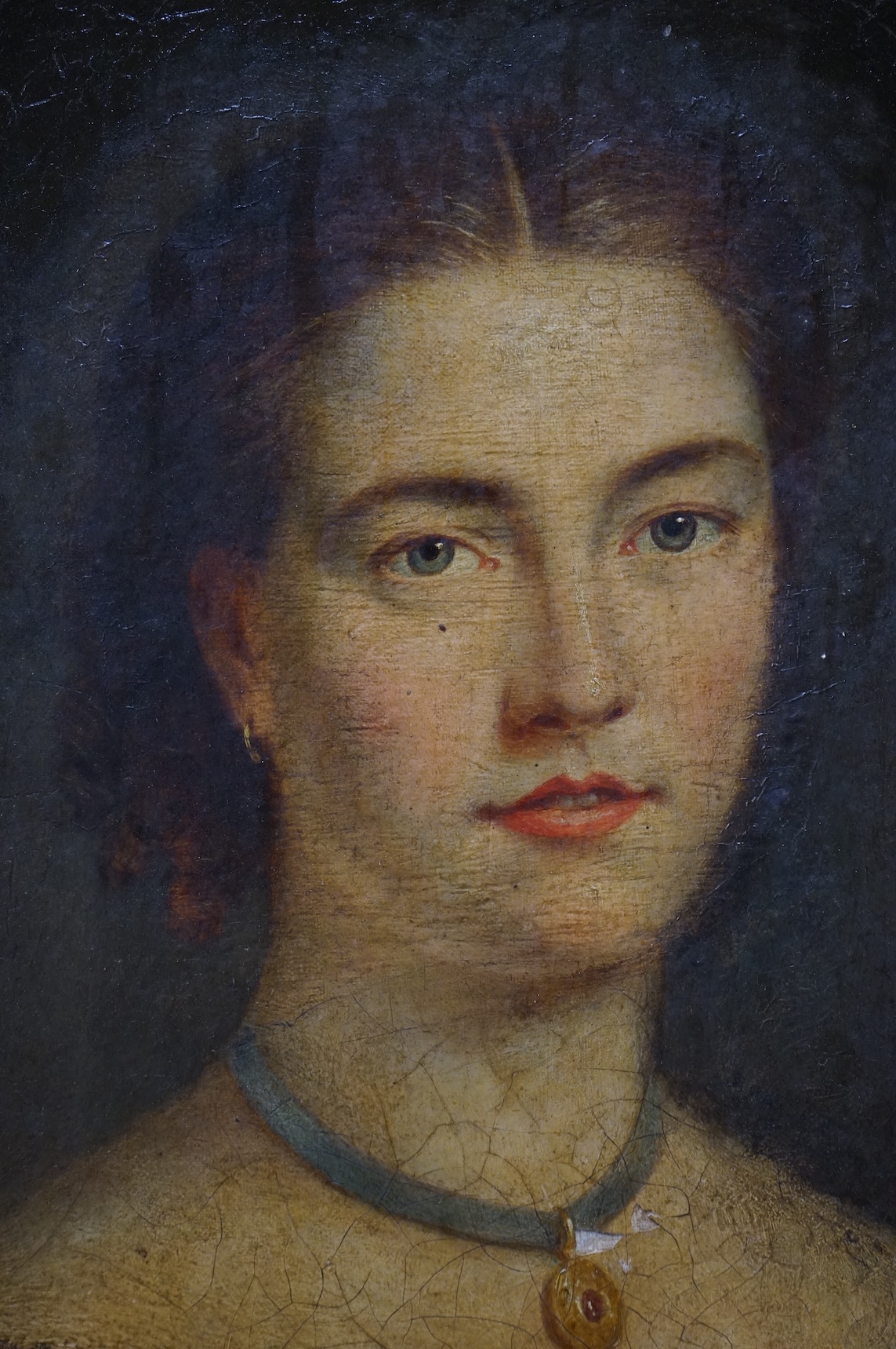 Late Victorian School, oval oil on board, Head and shoulders portrait of a young lady, unsigned, 58 x 45cm
